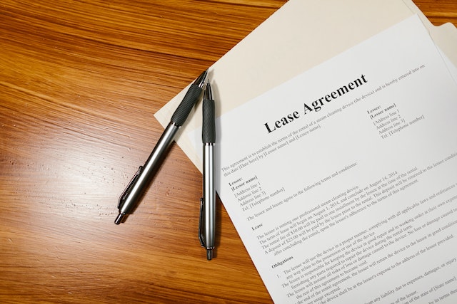 White printed paper with "Lease Agreement" at the top in black letters